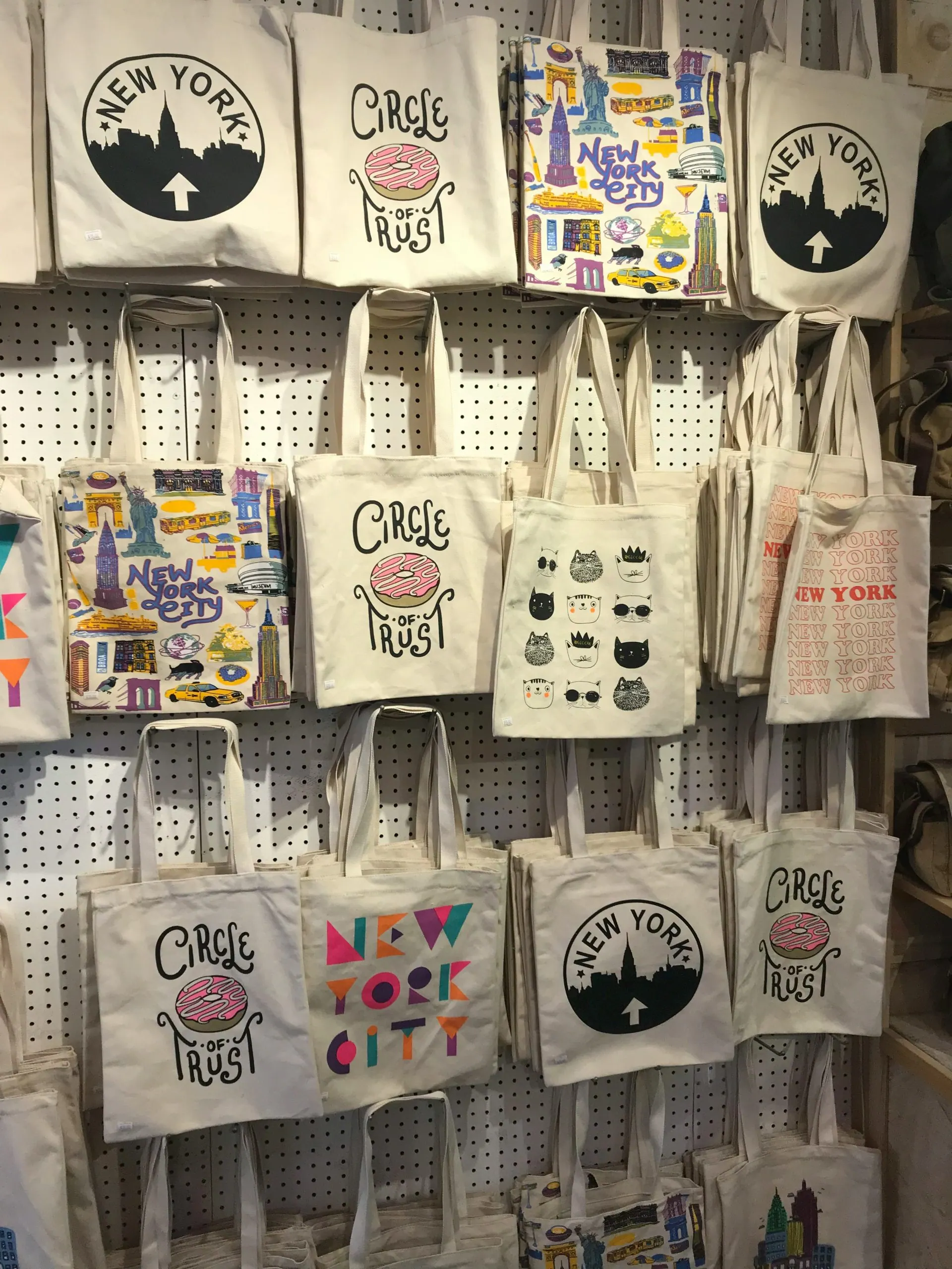 A wall of custom printed canvas bags