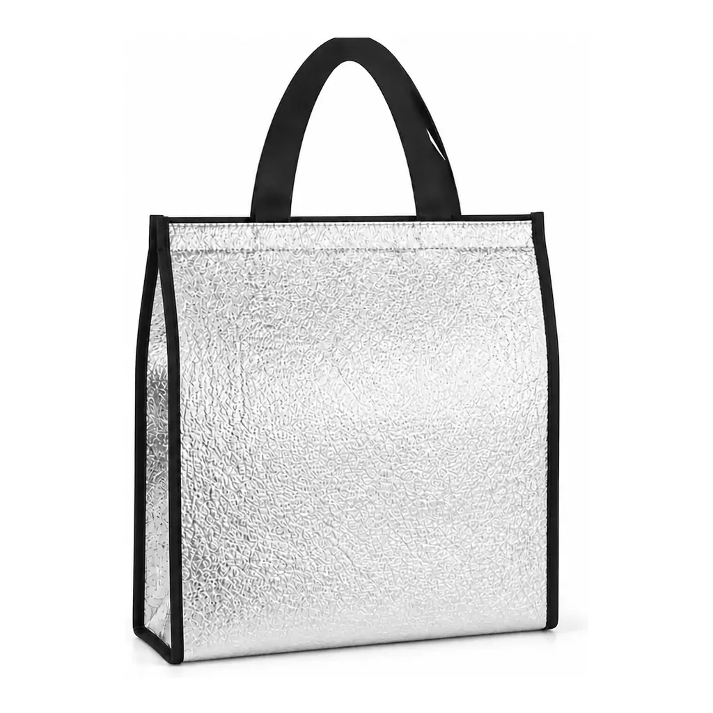 Two aluminum foil insulated bags with crinkled silver foil bodies, one with red binding and handles and one with black, standing on a kitchen counter