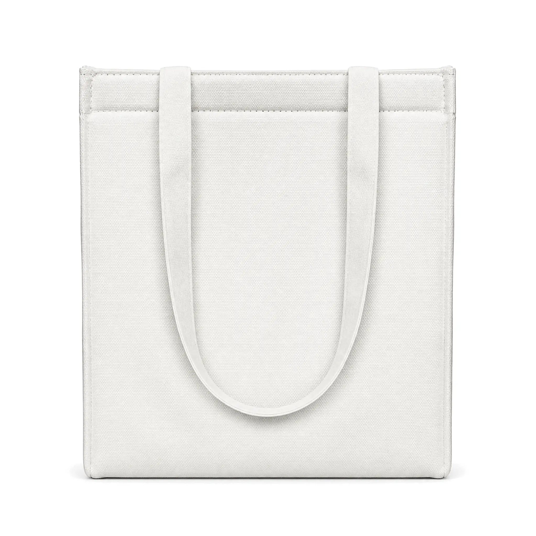 White 10oz canvas insulated lunch bag 25 x 30 x 12 cm with self-fabric handles and a top zipper, standing upright on a wooden desk beside a coffee cup and a sandwich plate