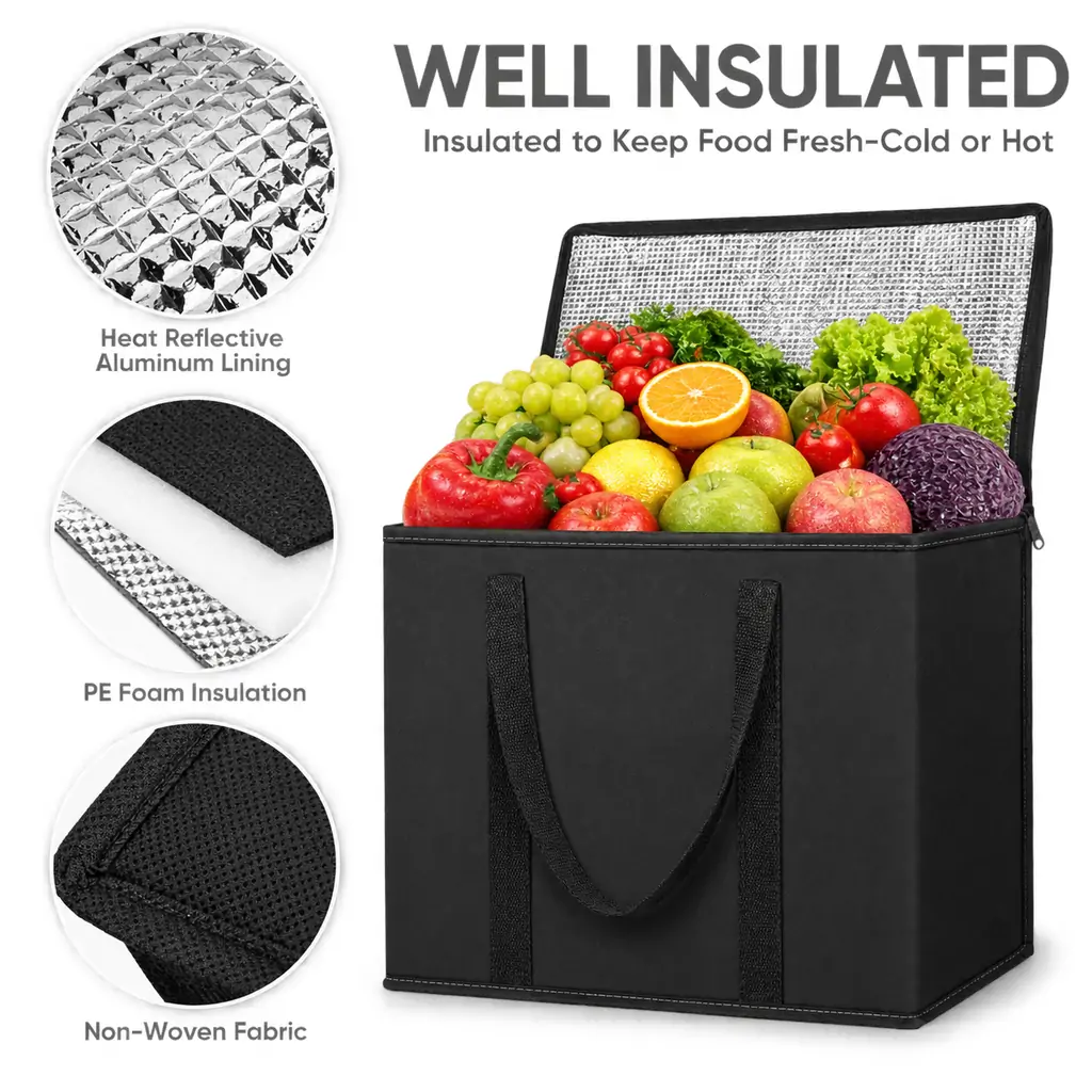 Black non-woven insulated grocery cooler bag 16 x 13 x 9 in with a zippered lid, webbing handles and a foil-lined interior filled with fresh produce, with close-up detail circles o