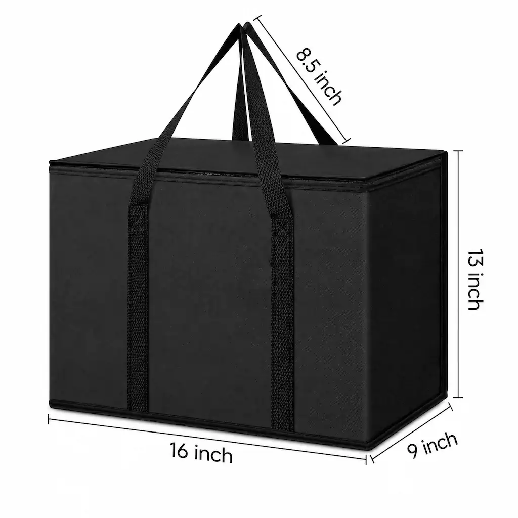 Black non-woven insulated grocery cooler bag 16 x 13 x 9 in with a zippered lid, webbing handles and a foil-lined interior filled with fresh produce, with close-up detail circles o