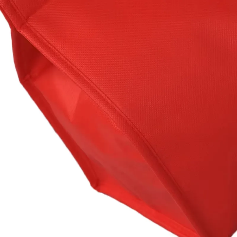 Red non-woven insulated lunch tote bag with handles and zipper closure