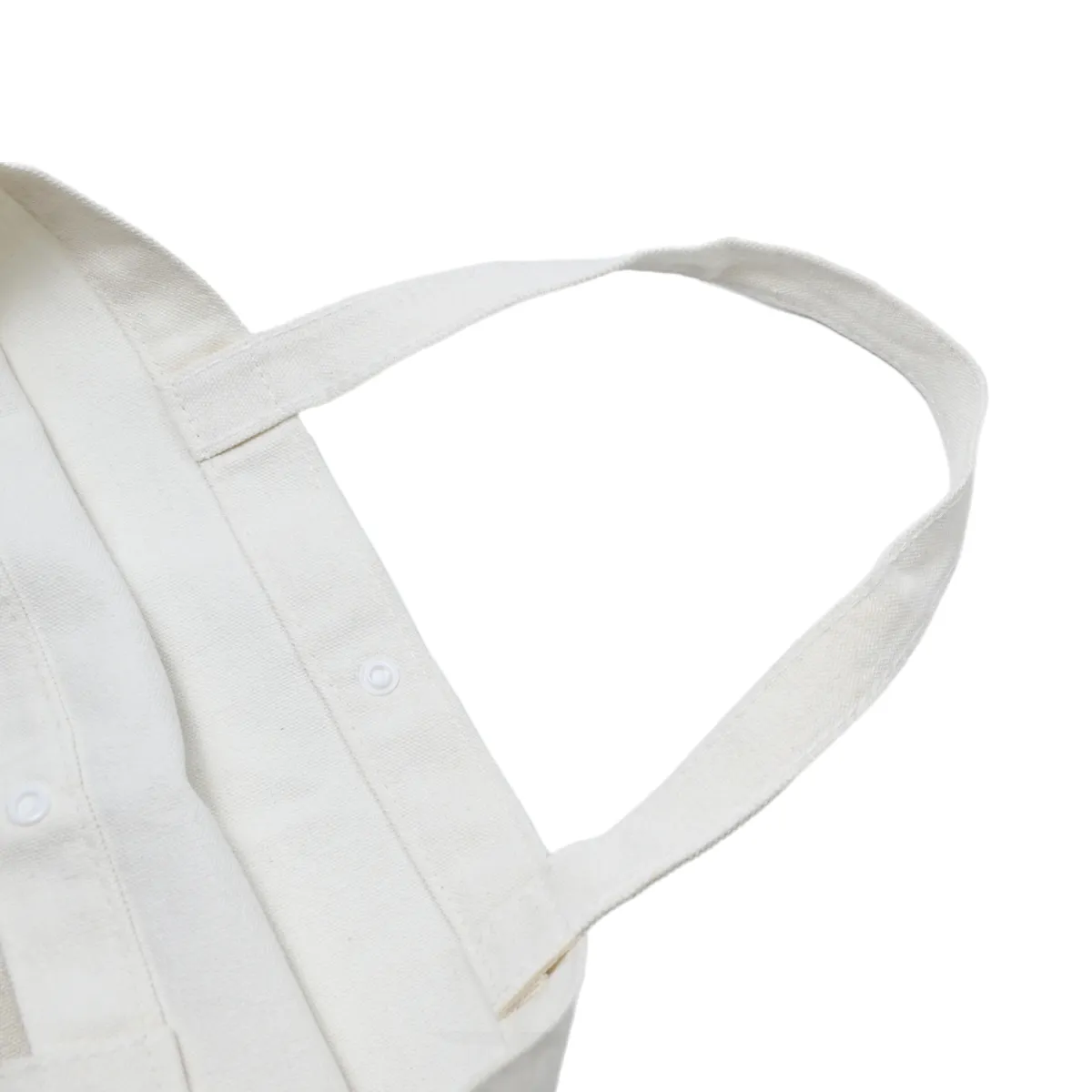 Second view of the natural canvas tote and its handle construction